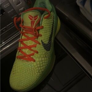 Nike Green Athletic Shoes with Red and Black Details